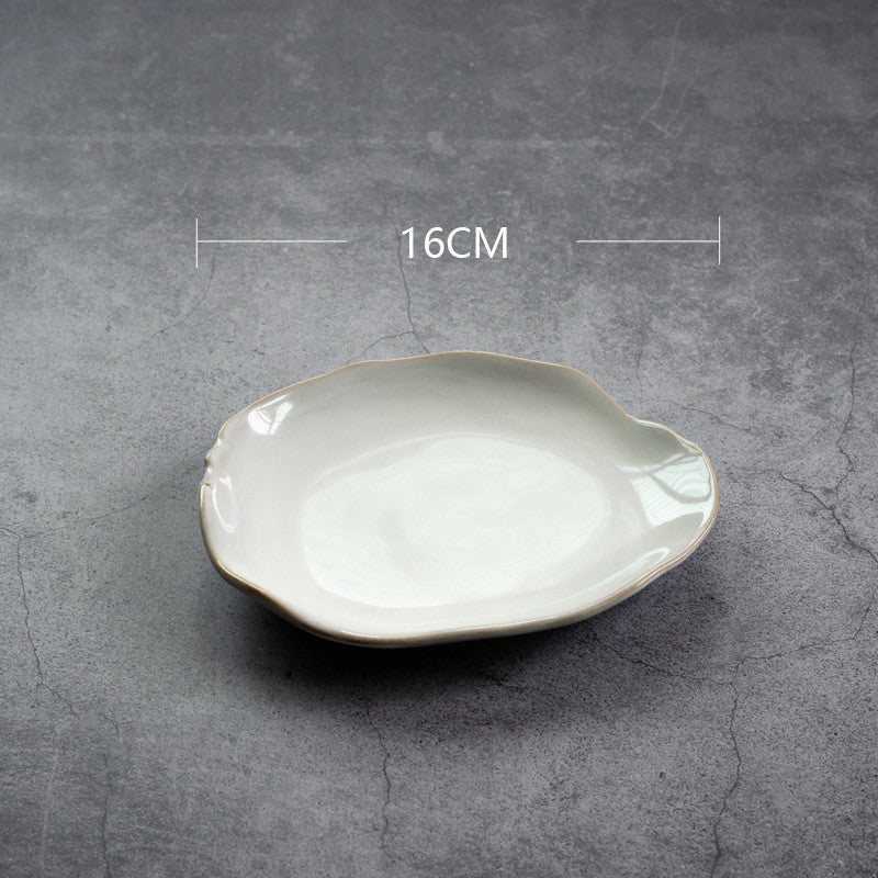 Irregular white ceramic plates and bowls