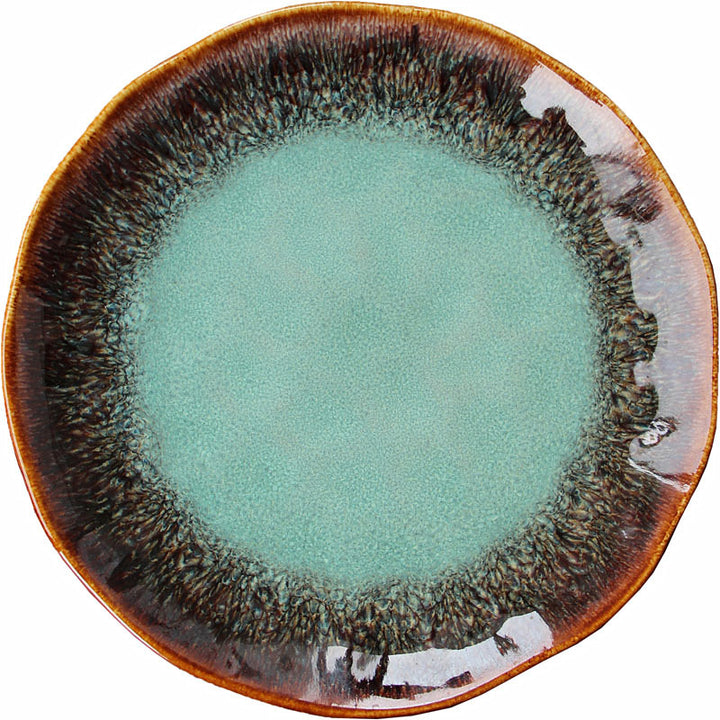Turquoise kiln-change glaze plate with a brown speckled rim, from above