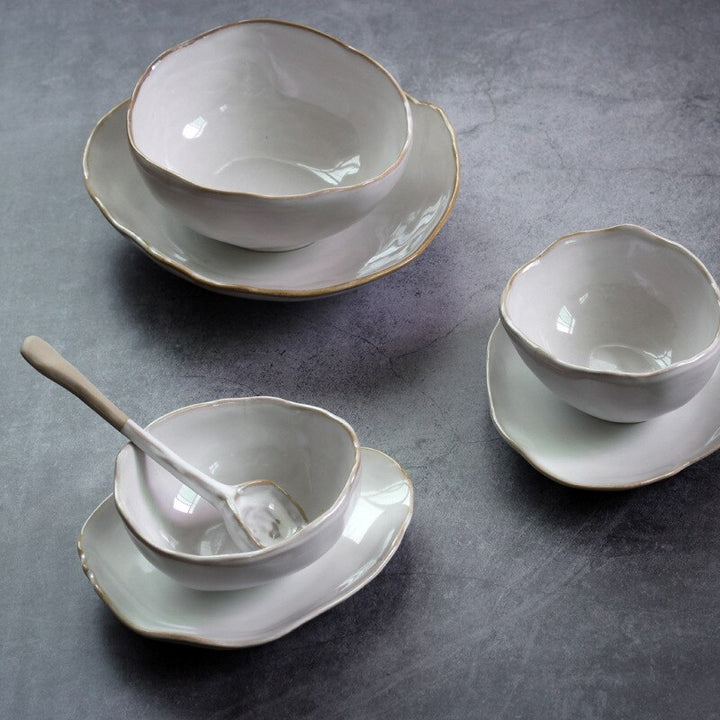 Irregular white ceramic plates and bowls