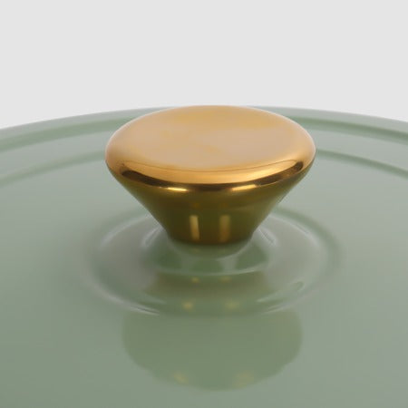 Gold-tone stainless steel knob on the sage green lid